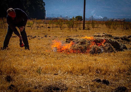 Setting the unprotected Hay on fire.